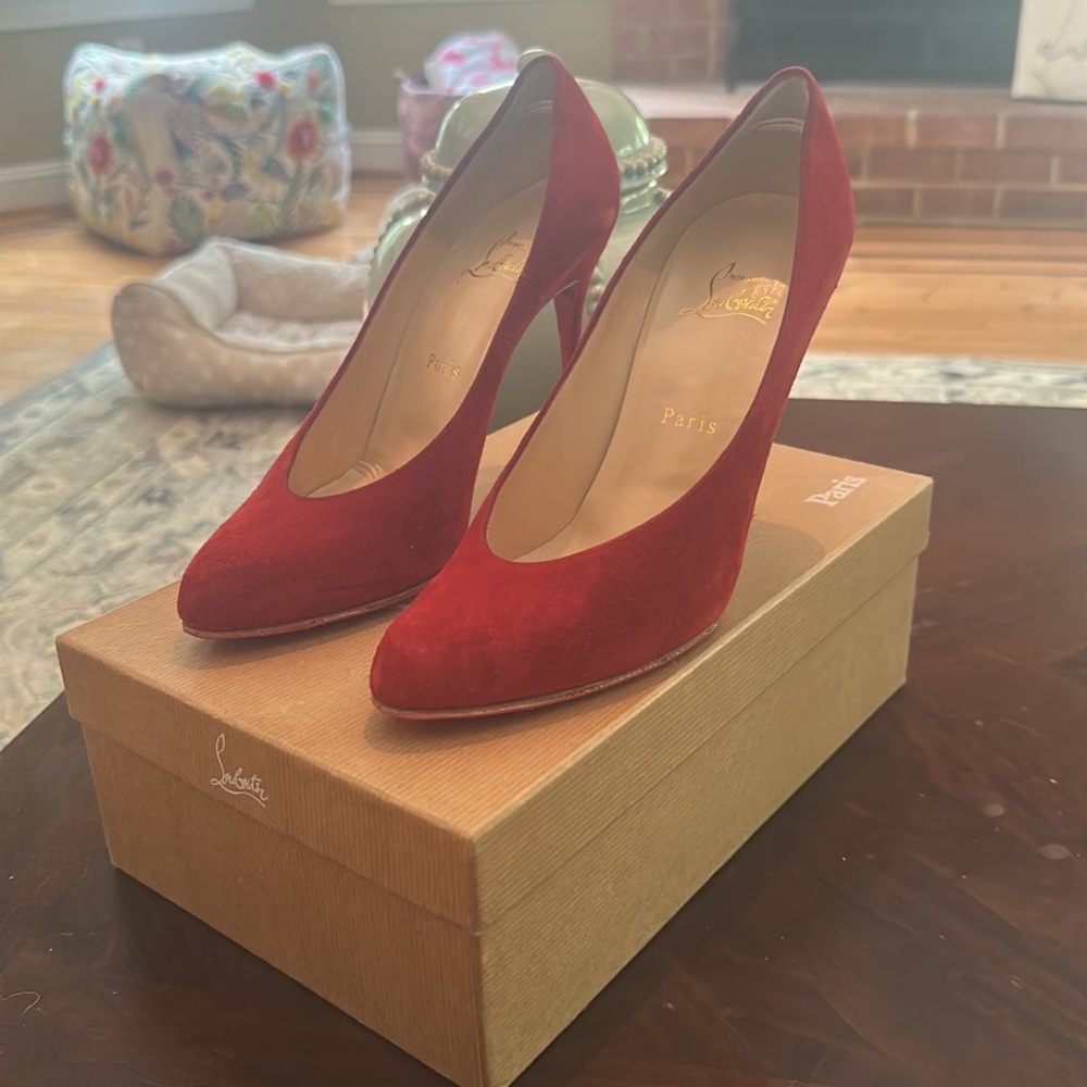 Christian Louboutin red suede heels.